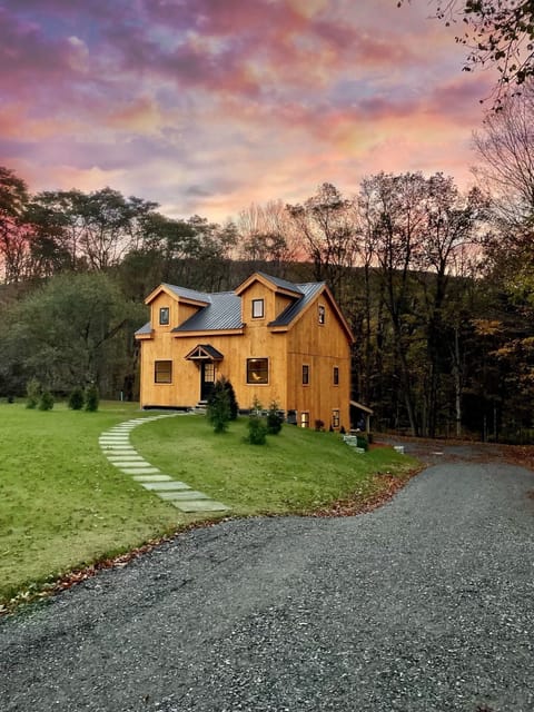 Surrounded by dozens of acres and a river, less than a mile from Okemo
