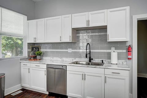 Our newly renovated kitchen is outfitted with sleek stainless steel appliances and fully stocked with plenty of cups, dishes, and a variety of pots and pans for cooking. A dedicated coffee station provides everything you need for your morning brew.