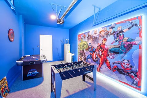 Garage-turned-games-room with air hockey and foosball