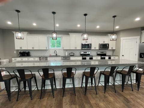 Double dishwashers, ranges, microwaves and large sink. 16 ft island with 8 seats