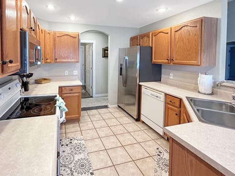 Spacious, fully equipped kitchen with full fridge, over/stove, microwave and drip and Keurig coffee