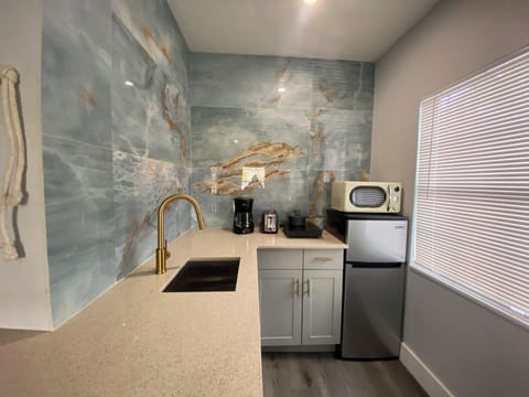 Mini-fridge, microwave, cookware/dishes/utensils