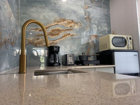 Mini-fridge, microwave, cookware/dishes/utensils