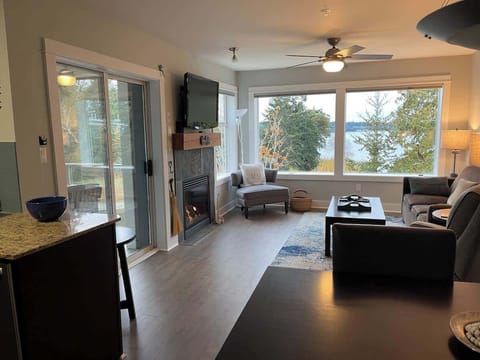 Living room with bay view and gas fireplace