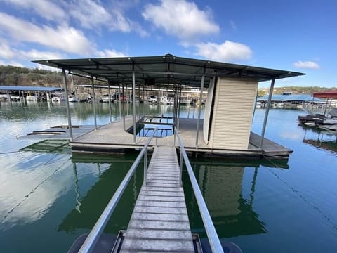Covered 25' boat slip with hoist and water craft dock