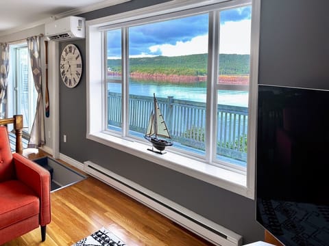 Living room with 65" TV and access to over 4,000 movies and TV shows from our personal collection