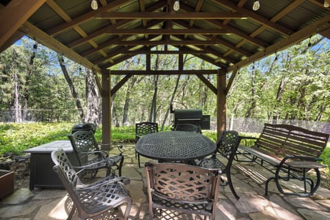 Covered pavilion with BBQ grill under the oaks