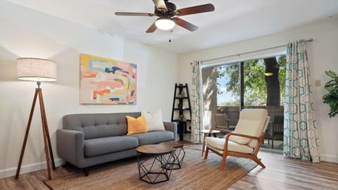 Living room with smart tv, comfortable seating and patio