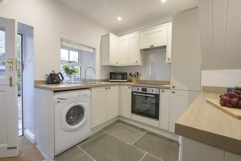 Ground floor: The stable door from the kitchen leads to the patio and outside seating area