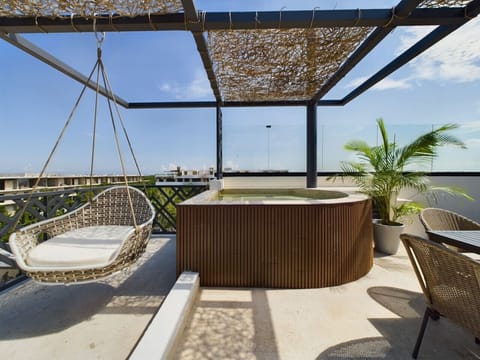 Sip and relax in your private pool with breathtaking Tulum views.