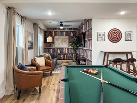 Lower level game room with pool table, foosball, and board games