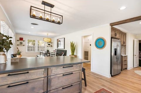 Extras in the country kitchen include plenty of cookware, dining ware, utensils, glasses, and complementary coffee and spices.