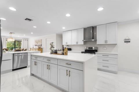 Large kitchen island and peninsula with stools.