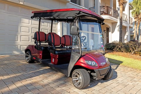 Golf cart ready for easy transportation around the property and local area exploration.