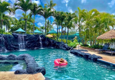 Main pool with waterfalls and plenty of lounge chairs. 