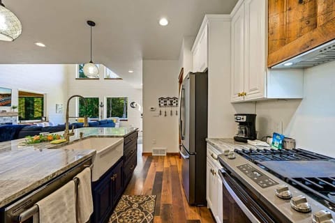 The chef's kitchen is well-appointed with top-of-the-line appliances, offering a gourmet experience for those who love to cook and entertain.