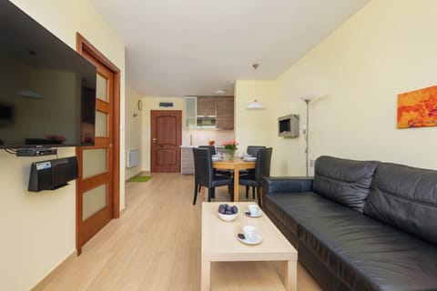 Living room with a comfortable sofa and TV. 