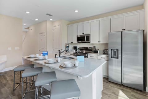 Inviting Kitchen of the cottage in Kissimmee Florida - Contemporary design with clean lines and minimalist aesthetics - Thoughtful placement of kitchen essentials for easy access