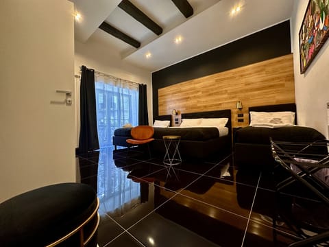 Deluxe Quadruple Room | In-room safe, desk, blackout drapes, soundproofing
