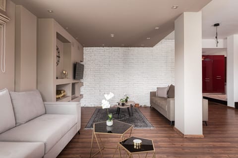 Family Apartment | Living area | 50-inch Smart TV with satellite channels, fireplace, Netflix