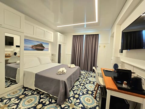 Deluxe Room, Balcony, City View | Free minibar, in-room safe, individually decorated