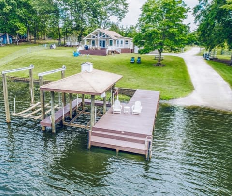 Large, fully fenced-in property w/private dock, boat ramp, fire pit, & furniture