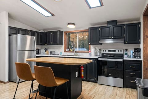 Gather together in the heart of the cabin – our spacious, well-appointed kitchen.