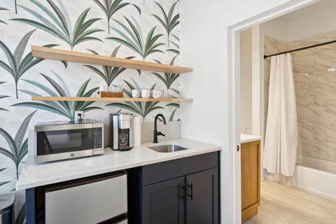 Microwave, Mini-fridge, Coffee station, & Bathroom Entrance