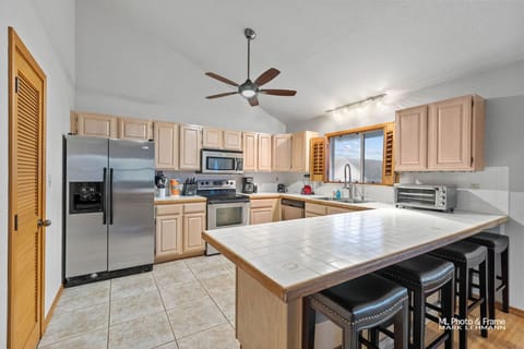 Fully equipped kitchen, with enough cookware, bakeware, dinnerware, utensils to prepare and enjoy a holiday meal.