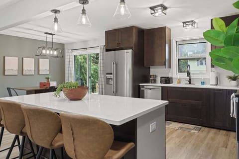 Open concept living, dining and kitchen area.