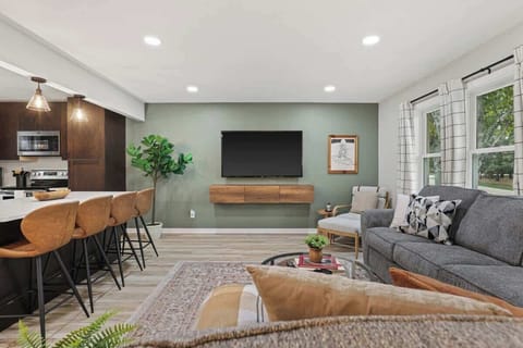 Open concept living, dining and kitchen area.