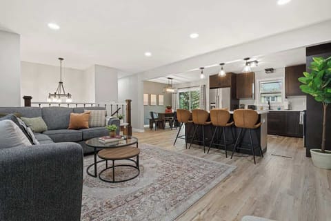 Open concept living, dining and kitchen area.