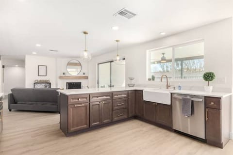 Calcatta quartz on espresso with champagne bronze and stainless finishes!