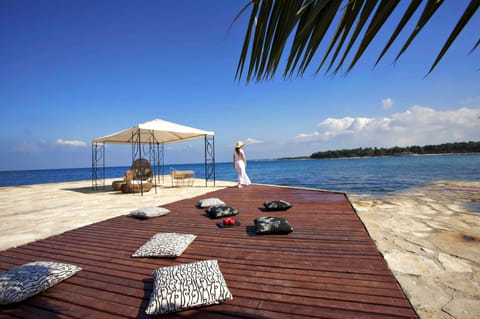 On the beach, sun loungers, beach umbrellas, beach volleyball