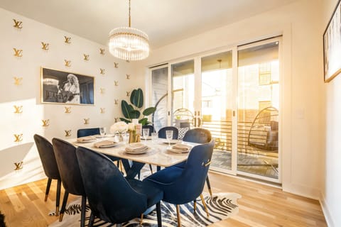 Gather around the chandelier-lit dining table while everyone can still see the balcony beyond, this is where the group lands before heading downtown to The Gulch