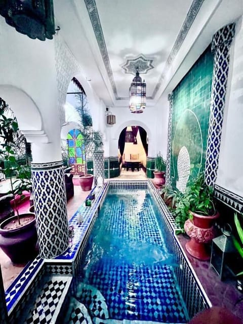 Indoor pool, pool umbrellas, sun loungers