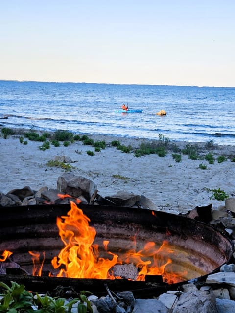 Warm sunset campfire on the beach