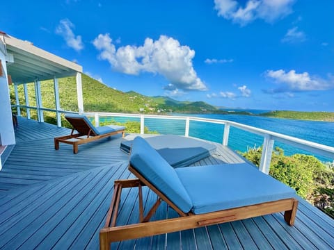 Outdoor lounge chairs by the hot tub