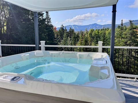 Escape to serenity with our hot tub, where the soothing waters and breathtaking mountain views combine to create a truly magical experience.