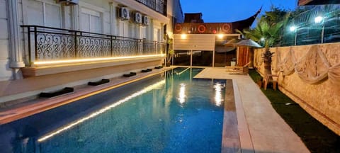 Seasonal outdoor pool, open 9:00 AM to 8:00 PM, pool umbrellas