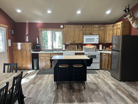 Kitchen Island works great for extra prep and serving space. Even adds 2 extra seats.