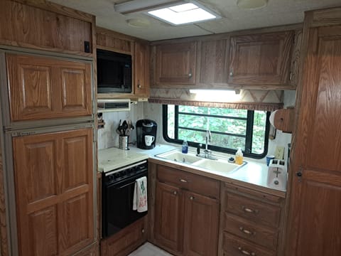 kitchen updated with new fridge, range, faucet, coffee maker