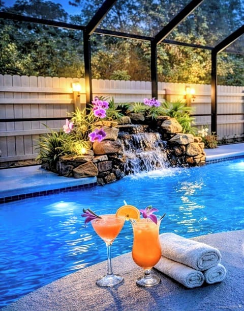 outdoor heated salt pool. With relaxing - soothing sounds of a waterfall !