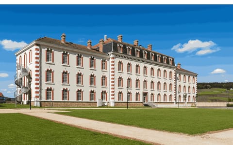 Stroll the manicured pathways leading up to the stunning historical structure, where comfort meets elegance.