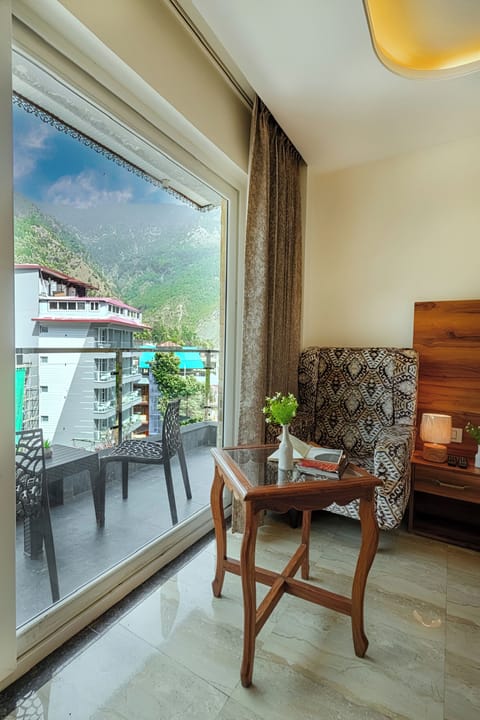 Super Deluxe Room with Balcony and Mountain view | Living area | 43-inch Smart TV with satellite channels