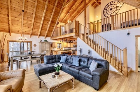 Open concept living room leading to 2nd floor loft and 2 additional bedrooms