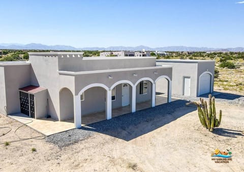 See the property from the left side. This drone shot of Casa Desert Rose in El Dorado Ranch San Felipe BC shows the full layout.