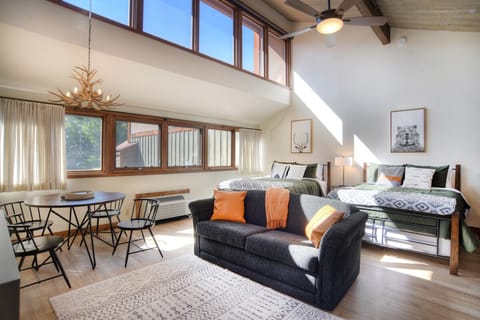 Studio Condo with Living, Dining, and Sleeping Arrangements - Tall Ceilings, Antler Chandelier, Natural Light, and Tasteful Furnishings