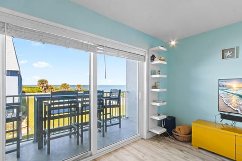 Sliding glass doors lead to private balcony