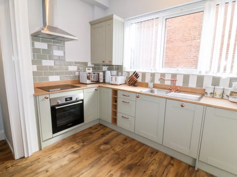 Fridge, electric kettle, toaster, cookware/dishes/utensils